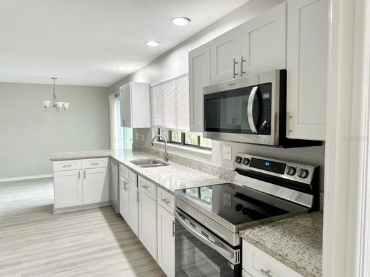 Chandelier, Interior, Kitchen, Recessed Lighting, Stainless Steel Appliances, Wood Texture Flooring