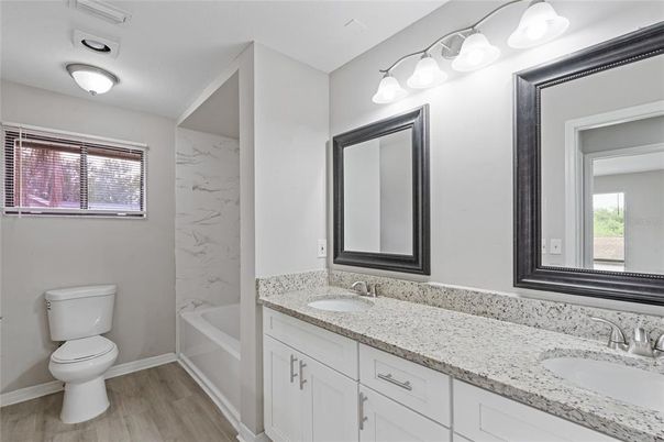 Bathroom, Dual Sink Vanities, Interior, Marble Walls, Wood Texture Flooring