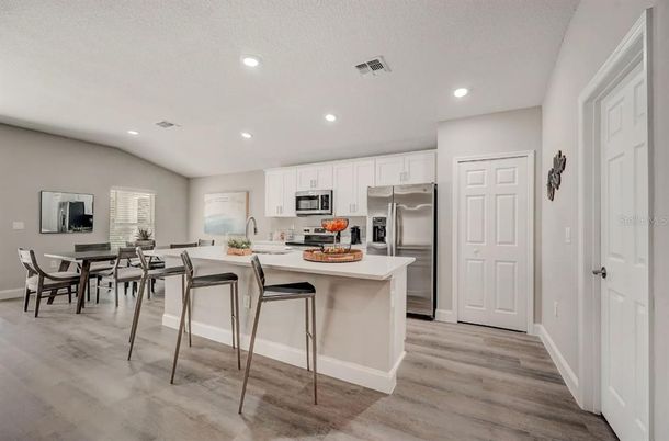 Dining room, Interior, Kitchen, Recessed Lighting, Stainless Steel Appliances, Wood Texture Flooring