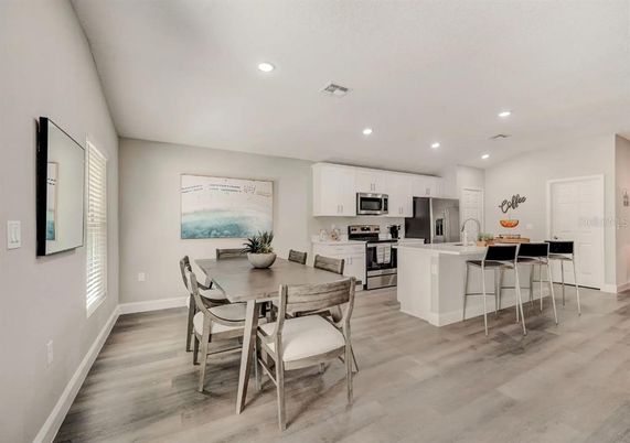 Dining room, Interior, Kitchen, Recessed Lighting, Stainless Steel Appliances, Wood Texture Flooring
