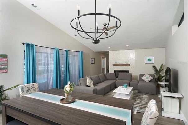 Chandelier, Dining room, Fireplace, Interior, Living room, Recessed Lighting, Wood Texture Flooring