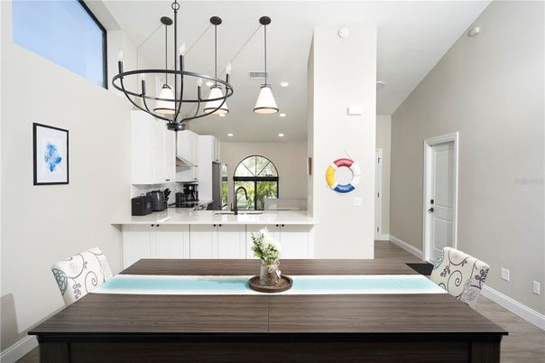 Chandelier, Interior, Kitchen, Pendant Lights, Recessed Lighting, Stainless Steel Appliances, Wood Texture Flooring
