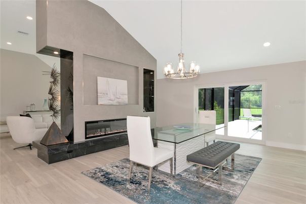Chandelier, Dining room, Fireplace, Interior, Pendant Lights, Recessed Lighting, Wood Texture Flooring