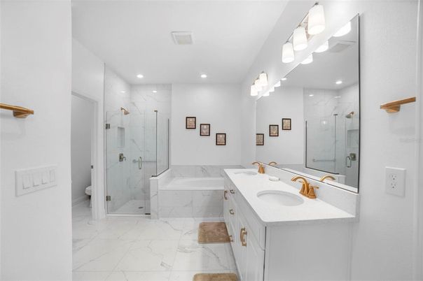 Bathroom, Dual Sink Vanities, Glass Shower, Interior, Marble, Marble Walls, Recessed Lighting
