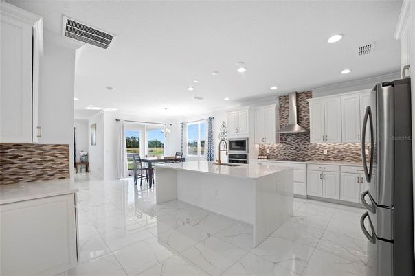 Dining room, Interior, Kitchen, Marble, Pendant Lights, Recessed Lighting, Stainless Steel Appliances