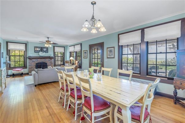 Chandelier, Dining room, Fireplace, Interior, Living room, Stone Walls, Wood Texture Flooring