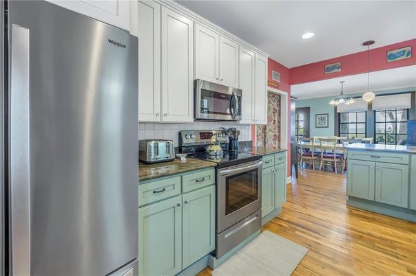 Dining room, Interior, Kitchen, Pendant Lights, Recessed Lighting, Stainless Steel Appliances, Wood Texture Flooring