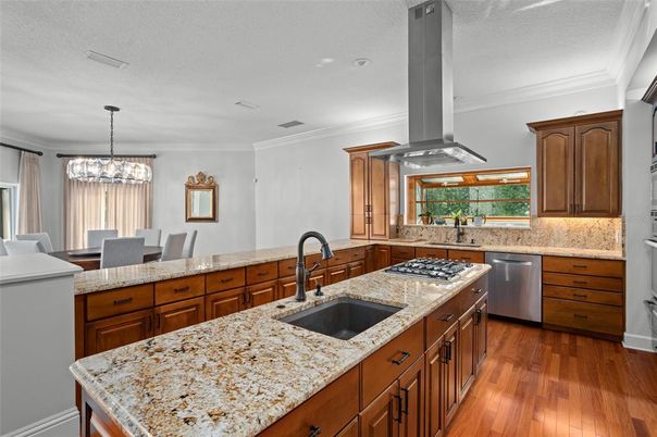 Dining room, Interior, Kitchen, Pendant Lights, Recessed Lighting, Stainless Steel Appliances, Wood Texture Flooring