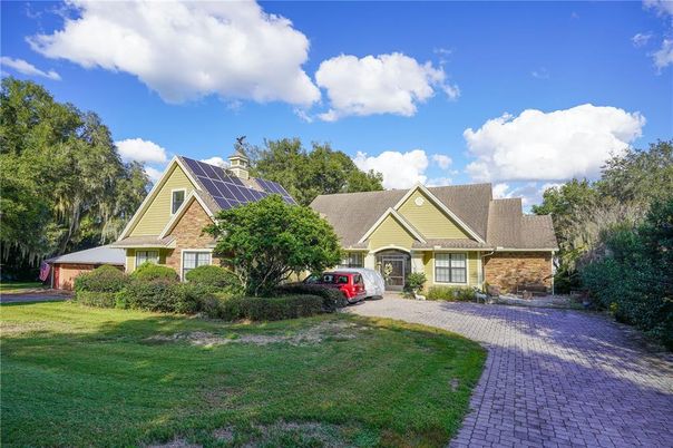 Attached, Backyard, Exterior, Facade, Solar Panels, Tudor Revival