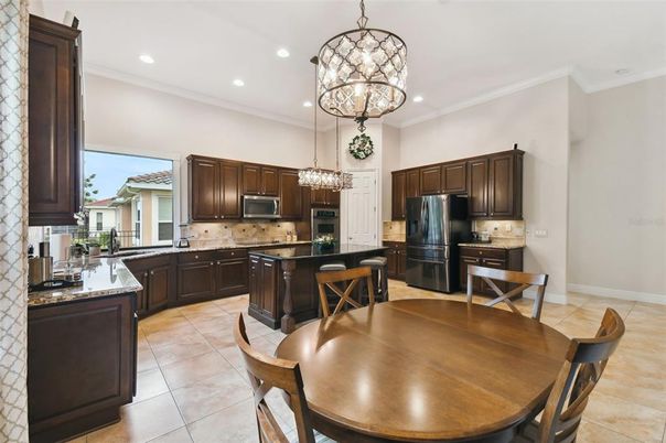 Chandelier, Dining room, Interior, Kitchen, Pendant Lights, Recessed Lighting, Stainless Steel Appliances