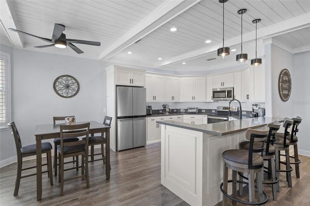 Dining room, Interior, Kitchen, Pendant Lights, Recessed Lighting, Stainless Steel Appliances, Wood Texture Flooring