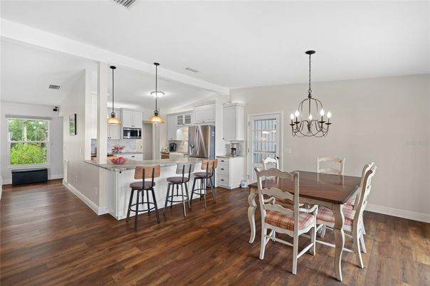 Chandelier, Dining room, Interior, Kitchen, Pendant Lights, Stainless Steel Appliances, Wood Texture Flooring