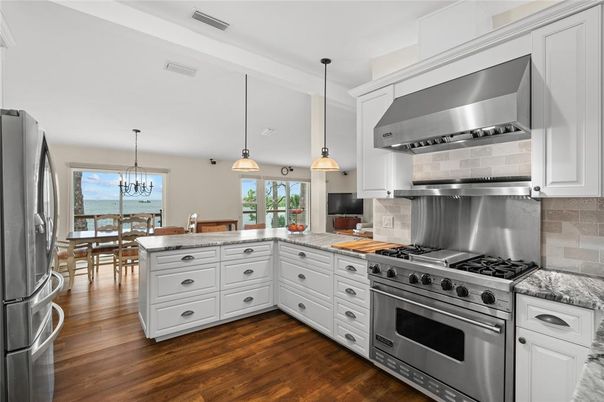 Chandelier, Dining room, Interior, Kitchen, Pendant Lights, Stainless Steel Appliances, Water, Wood Texture Flooring
