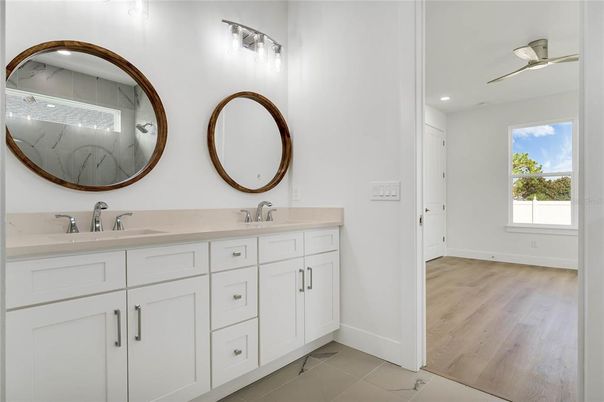 Bathroom, Dual Sink Vanities, Interior, Recessed Lighting, Wood Texture Flooring