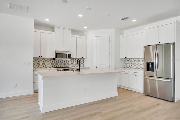 Interior, Kitchen, Recessed Lighting, Stainless Steel Appliances, Wood Texture Flooring