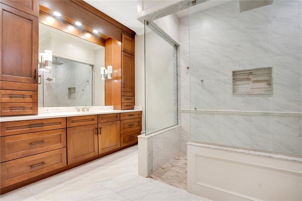 Bathroom, Dual Sink Vanities, Glass Shower, Interior, Marble, Marble Walls, Recessed Lighting