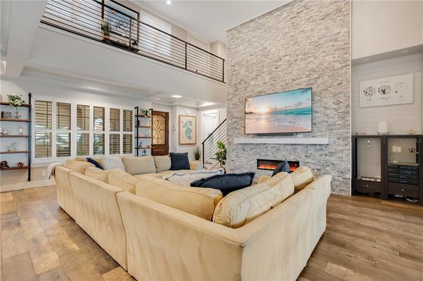 Fireplace, Interior, Living room, Recessed Lighting, Stone Walls, Wood Texture Flooring