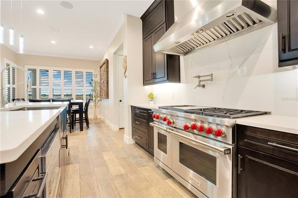Dining room, Interior, Kitchen, Pendant Lights, Recessed Lighting, Stainless Steel Appliances, Wood Texture Flooring