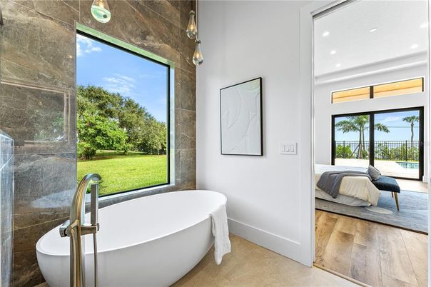 Bathroom, Free Standing Baths, Interior, Pendant Lights, Recessed Lighting, Wood Texture Flooring