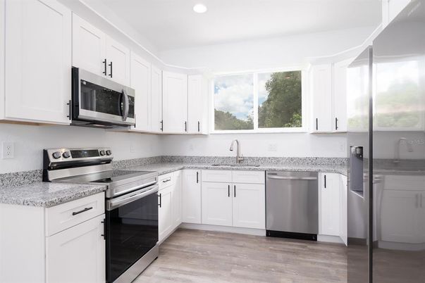 Interior, Kitchen, Recessed Lighting, Stainless Steel Appliances, Wood Texture Flooring