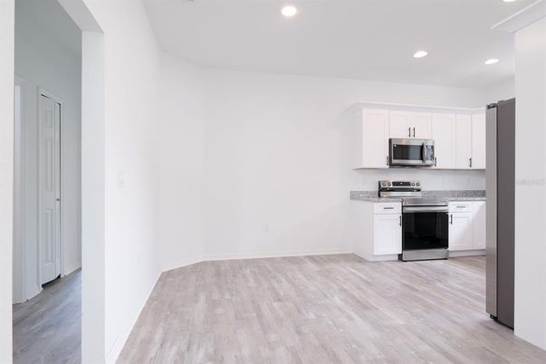 Interior, Kitchen, Recessed Lighting, Stainless Steel Appliances, Wood Texture Flooring