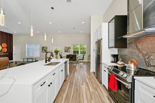 Dining room, Interior, Kitchen, Pendant Lights, Recessed Lighting, Stainless Steel Appliances, Wood Texture Flooring