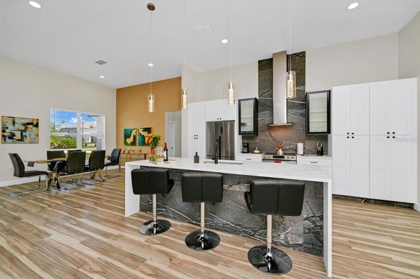 Dining room, Interior, Kitchen, Pendant Lights, Recessed Lighting, Stainless Steel Appliances, Wood Texture Flooring