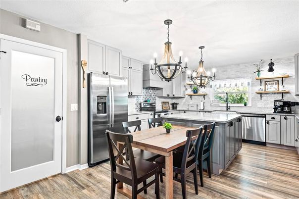 Chandelier, Dining room, Interior, Kitchen, Stainless Steel Appliances, Wood Texture Flooring