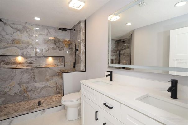 Bathroom, Dual Sink Vanities, Glass Shower, Interior, Marble Walls, Recessed Lighting