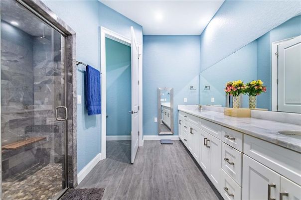 Bathroom, Dual Sink Vanities, Glass Shower, Interior, Recessed Lighting, Wood Texture Flooring