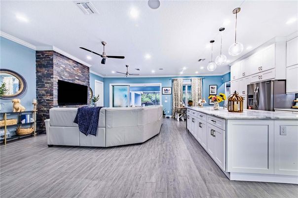 Interior, Kitchen, Living room, Pendant Lights, Recessed Lighting, Stainless Steel Appliances, Stone Walls, Wood Texture Flooring