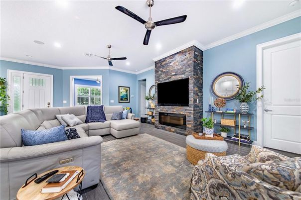 Fireplace, Interior, Living room, Recessed Lighting, Stone Walls, Wood Texture Flooring