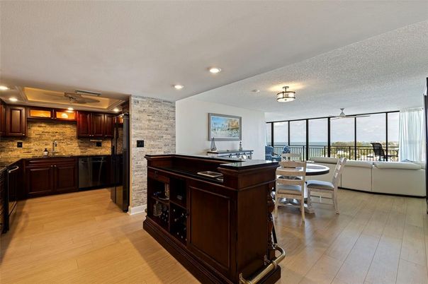 Dining room, Interior, Kitchen, Living room, Recessed Lighting, Stone Walls, Wood Texture Flooring