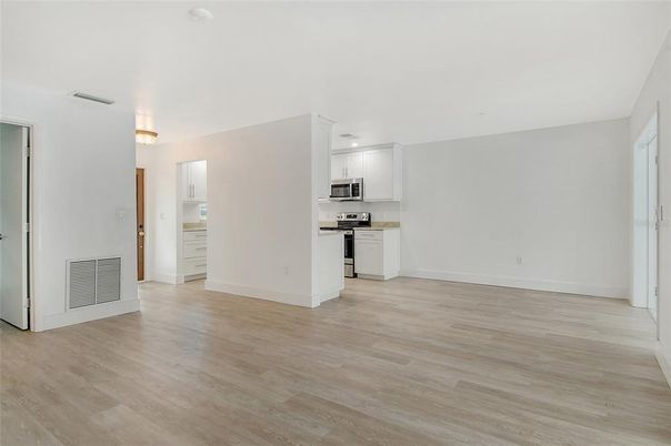 Empty room, Interior, Kitchen, Stainless Steel Appliances, Wood Texture Flooring