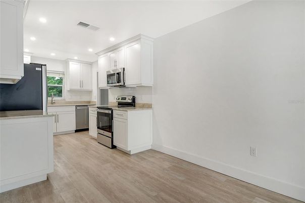 Interior, Kitchen, Recessed Lighting, Stainless Steel Appliances, Wood Texture Flooring