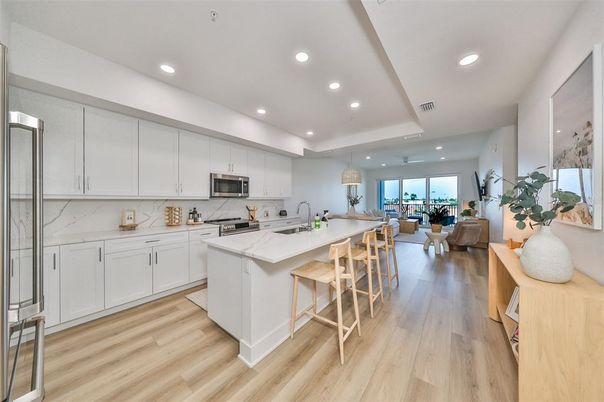 Interior, Kitchen, Marble Walls, Recessed Lighting, Stainless Steel Appliances, Wood Texture Flooring