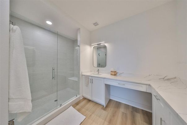 Bathroom, Dual Sink Vanities, Glass Shower, Interior, Recessed Lighting, Wood Texture Flooring
