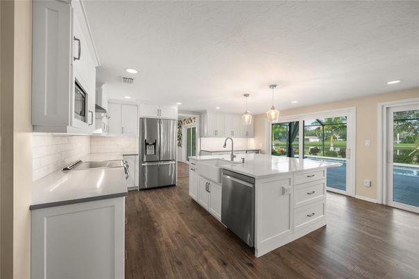 Interior, Kitchen, Pendant Lights, Recessed Lighting, Stainless Steel Appliances, Wood Texture Flooring