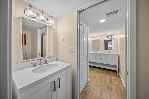 Bathroom, Dual Sink Vanities, Interior, Recessed Lighting, Wood Texture Flooring
