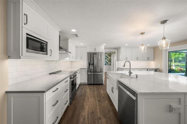 Interior, Kitchen, Pendant Lights, Recessed Lighting, Stainless Steel Appliances, Wood Texture Flooring