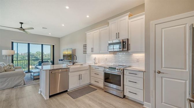 Dining room, Interior, Kitchen, Living room, Recessed Lighting, Stainless Steel Appliances, Wood Texture Flooring