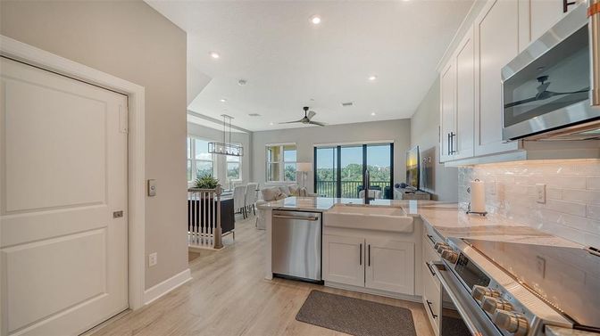 Dining room, Interior, Kitchen, Pendant Lights, Recessed Lighting, Stainless Steel Appliances, Wood Texture Flooring