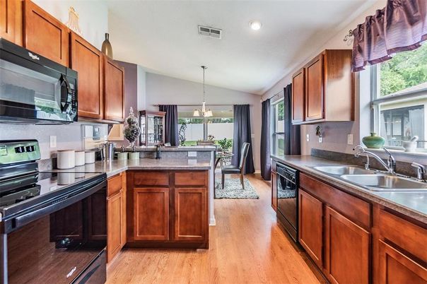 Dining room, Interior, Kitchen, Pendant Lights, Recessed Lighting, Stainless Steel Appliances, Wood Texture Flooring