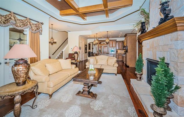 Chandelier, Dining room, Fireplace, Interior, Kitchen, Living room, Pendant Lights, Recessed Lighting, Stone Walls, Wooden Beams, Wood Texture Flooring