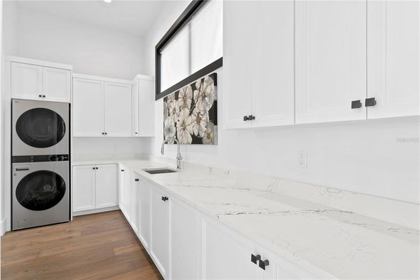 Interior, Kitchen, Recessed Lighting, Washer, Wood Texture Flooring