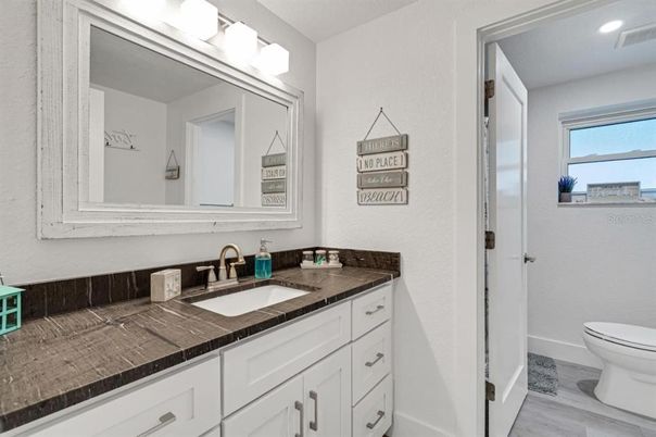 Bathroom, Interior, Recessed Lighting, Tile Countertops, Wood Texture Flooring