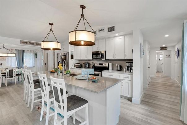 Dining room, Interior, Kitchen, Pendant Lights, Recessed Lighting, Stainless Steel Appliances, Wood Texture Flooring