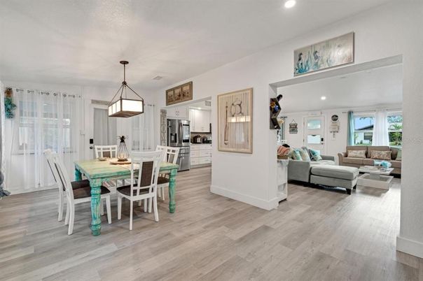 Dining room, Interior, Kitchen, Living room, Pendant Lights, Recessed Lighting, Stainless Steel Appliances, Wood Texture Flooring