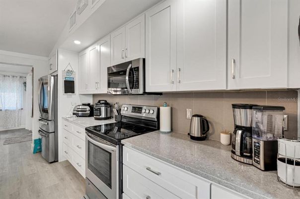 Interior, Kitchen, Recessed Lighting, Stainless Steel Appliances, Wood Texture Flooring