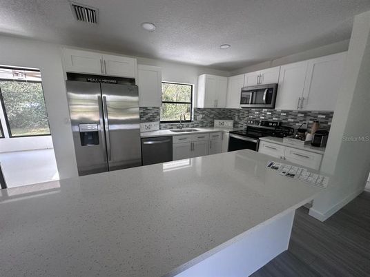 Interior, Kitchen, Recessed Lighting, Stainless Steel Appliances, Wood Texture Flooring
